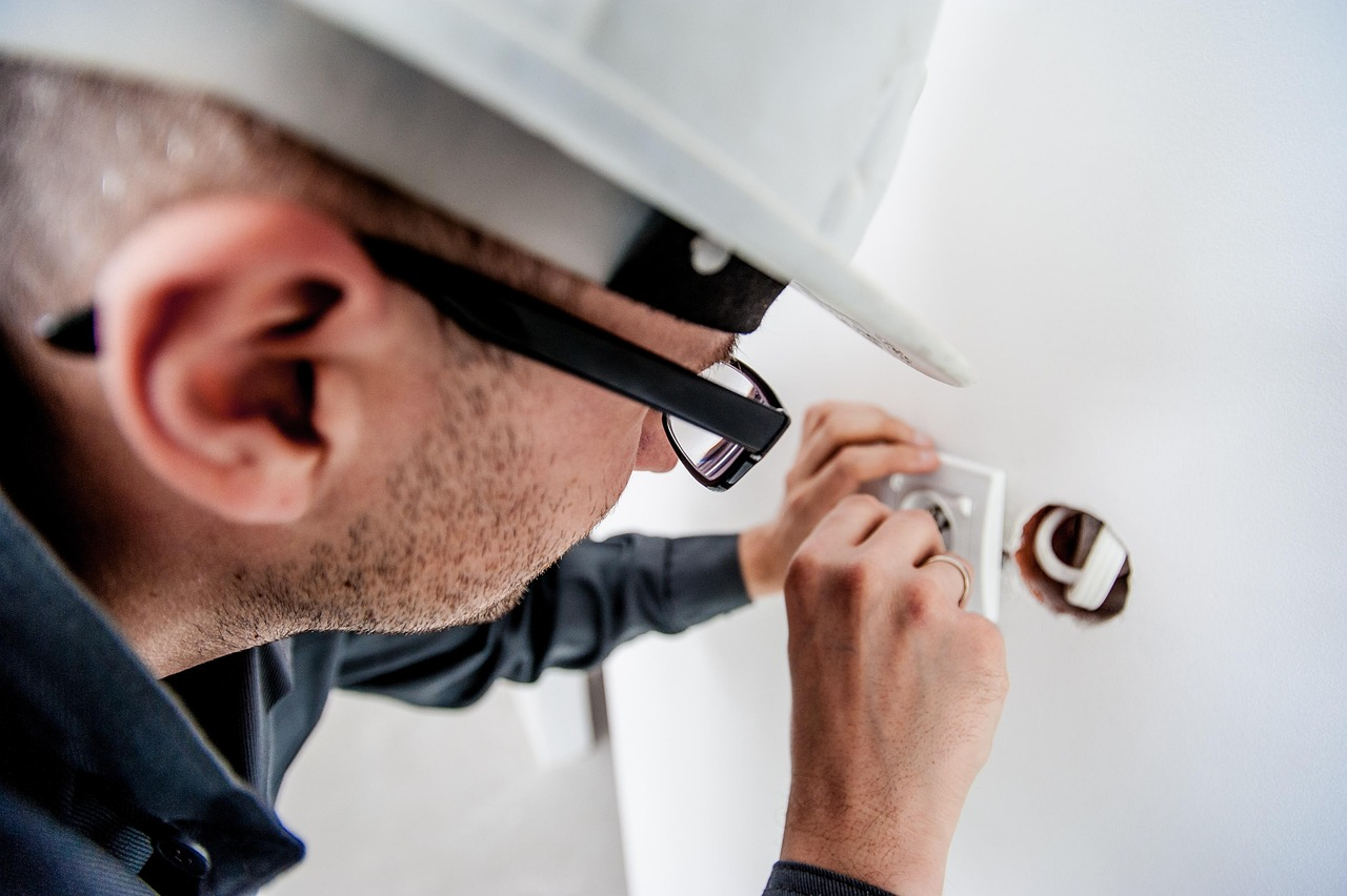 Photo of an engineer working on an electric socket