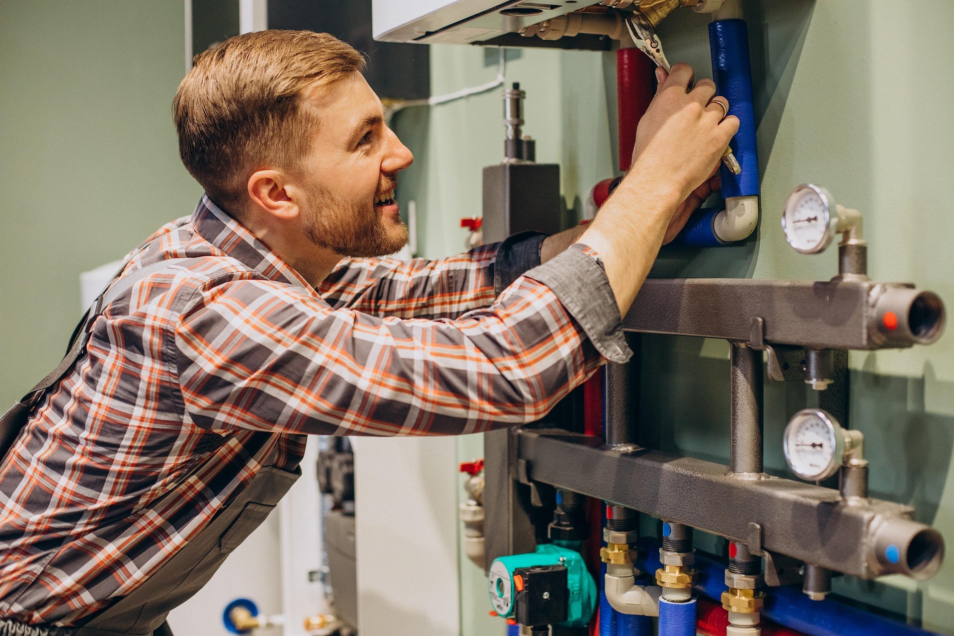 Photo of an engineer working on a boiler