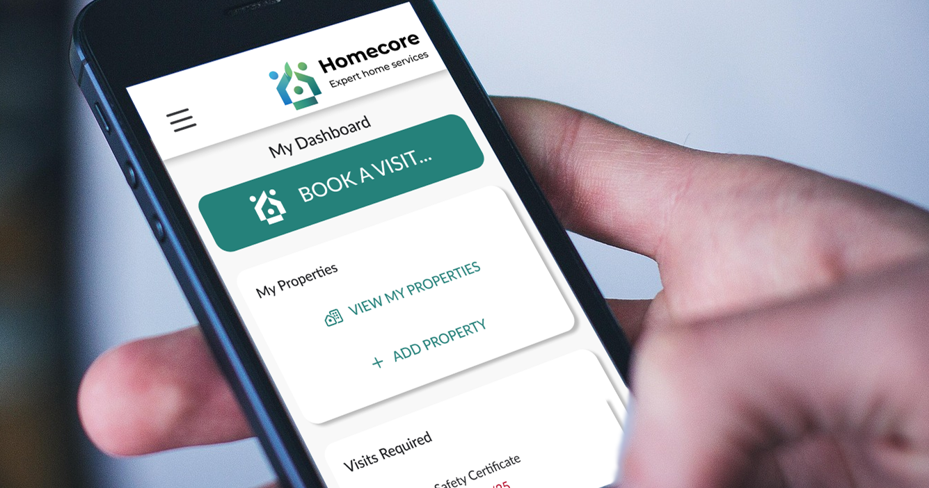 Photo of a hand holding a mobile phone, with the Homecore system on screen